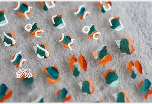Macro detail of abstract oil painting style nail stickers with matte finish on dark velvet