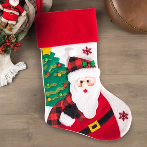Detail of Christmas stocking featuring 3D Santa and embroidery on wooden background