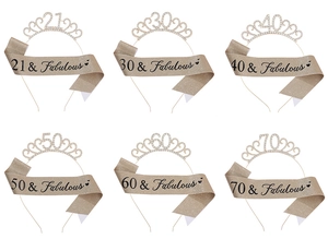 Birthday party set featuring rhinestone number crowns and glitter sashes for various ages