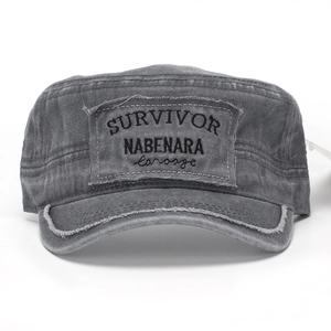 Detail of vintage washed cadet cap with Survivor embroidery and distressed edge effects