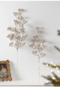 Close-up of champagne gold glitter berry branches for Christmas floral decoration