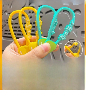 Detail of soft PVC wrist straps in yellow and cyan with adjustable buckle for keychains