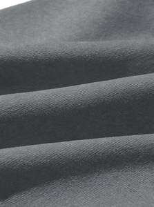 Detailed macro shot of dark grey knitted fabric showing premium tight weave texture