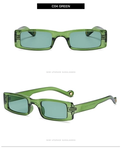 Detail view of rectangular green translucent sunglasses with light blue lenses and C04 branding