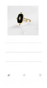 Detail of 18K gold plated 316L stainless steel ring with black stone and cross pattern