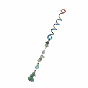 Detail of a rainbow metal spiral hair ring with natural green stone beads on white background
