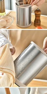 Close-up of hand cleaning the waterproof stainless steel kitchen utensil holder surface