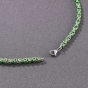 Close-up of 4mm Byzantine chain with green coating and lobster clasp in stainless steel