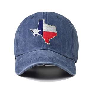 Macro detail of Texas state flag map embroidery on blue washed cotton baseball cap