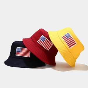 Navy blue, wine red, and yellow cotton bucket hats with embroidered American flag patches