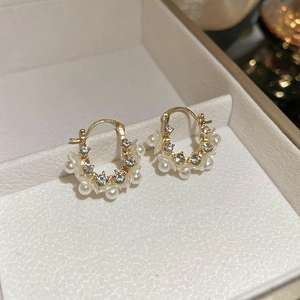 Elegant gold flower hoop earrings with white pearls and sparkling cubic zirconia crystals