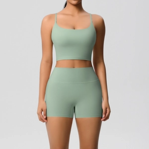 Detailed front view of sage green yoga set with slim straps and high waist shorts