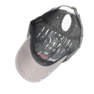 Internal view of washed cotton ponytail baseball cap with 100% cotton label and metal buckle