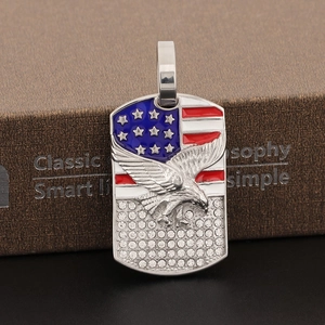 Detailed view of hip hop eagle pendant with American flag enamel and rhinestone accents