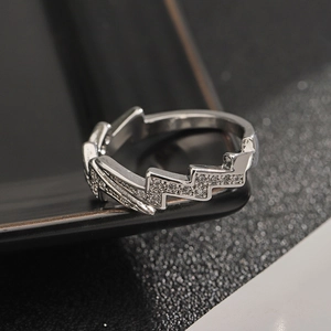 Adjustable silver lightning bolt ring with sparkling pavé rhinestones in a modern style