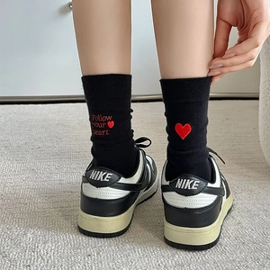 Detail of cotton crew socks with red heart embroidery and Follow your heart text