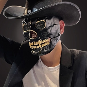Realistic black and gold skull mask for Halloween cosplay with a moving jaw effect