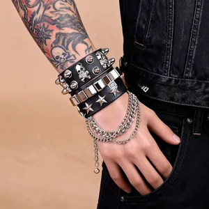 Detail of multilayer punk leather bracelet with metallic skulls, rivets and star studs