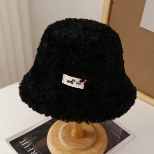 Thick black faux lamb wool aviator hat for women with cute ear flaps and decorative patch