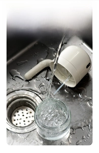 Close-up detail shot of the kitchen oil dispenser showing easy cleaning and disassembly.