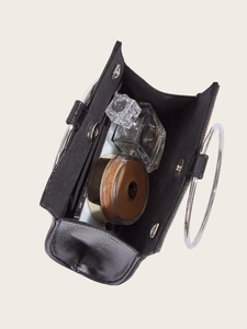 Top view of black evening clutch showing interior capacity for phone and cosmetics