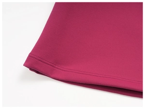 Close-up of rose red yoga wear featuring premium double-stitch knitting texture and hem detail