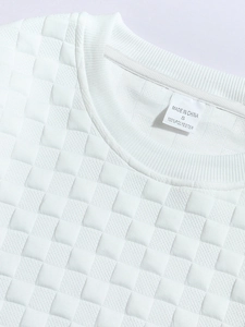 Detail of white waffle knit texture and neckline label on long sleeve men's slim shirt