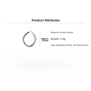 Detail view of multi-layer velvet cord choker with silver beads and heart pendant