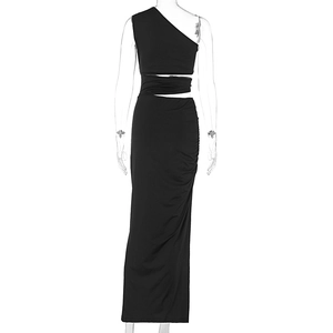 Close-up of ruched side detailing and cut-out waist on black one-shoulder maxi dress