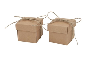 Close-up of square kraft paper candy boxes with natural twine bow tie decorations