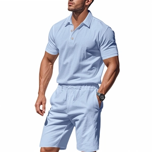 Close-up of light blue linen polo shirt and shorts set with waffle texture and drawstring