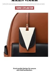 Detail of tricolor backpack with white canvas triangle charm and golden metal rivet