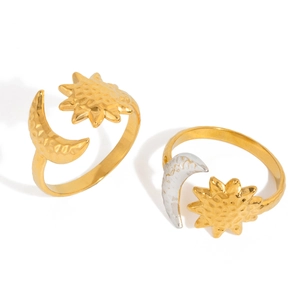 Hammered 18K gold and silver sun and moon adjustable rings on a white background