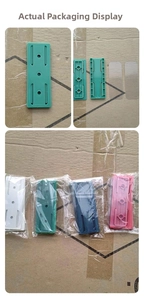 Detail view of adhesive power strip fixers in four colors with packaging components