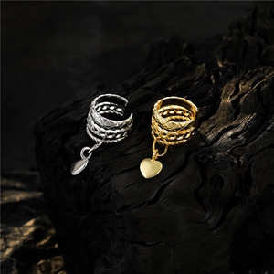 Minimalist heart charm ear cuff earrings in gold and silver with woven metal texture