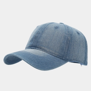 Close-up of a washed blue denim baseball cap showing six-panel structure and stitching