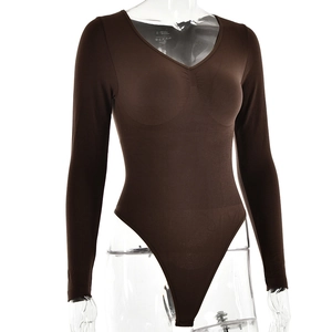 Close-up of brown long sleeve ribbed bodysuit featuring size S fabric care label