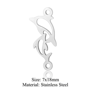 Macro detail of 7x18mm double dolphin stainless steel pendant for jewelry DIY