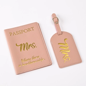 Detail of pink PU leather passport cover and luggage tag with gold Mrs. lettering
