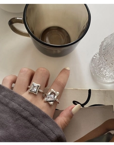 Close-up of 925 sterling silver open rings with clear cubic zirconia on hand