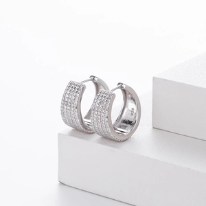 Detailed macro view of S925 sterling silver hoop earrings with micro-pave cubic zirconia