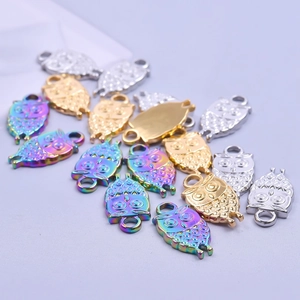 Polished owl-shaped stainless steel charms in silver, gold, and rainbow finishes