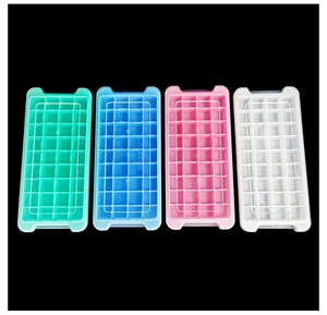 Detailed top view of a 4-piece set of colorful ice cube trays with clear lids on black