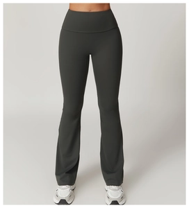 Detailed view of dark grey high-waisted flared yoga pants with sculpting waist design