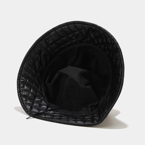 Modern black quilted bucket hat with a diamond pattern and stylish glossy finish