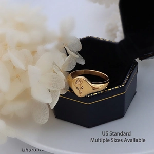 French style 18k gold plated rose signet ring displayed in a velvet jewelry box