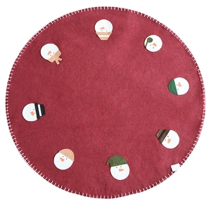 Red wool felt Christmas tree skirt featuring eight colorful snowman head appliqués