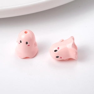 Close-up of pink ghost acrylic charms for DIY jewelry and phone chain accessories