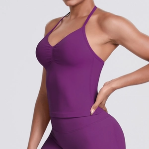 Detail view of purple seamless ribbed sports top with v-neck ruching and slim fit