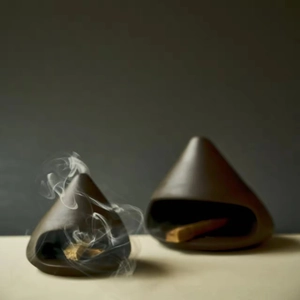 Minimalist ceramic Palo Santo holder set with burning wood block and smoke effect